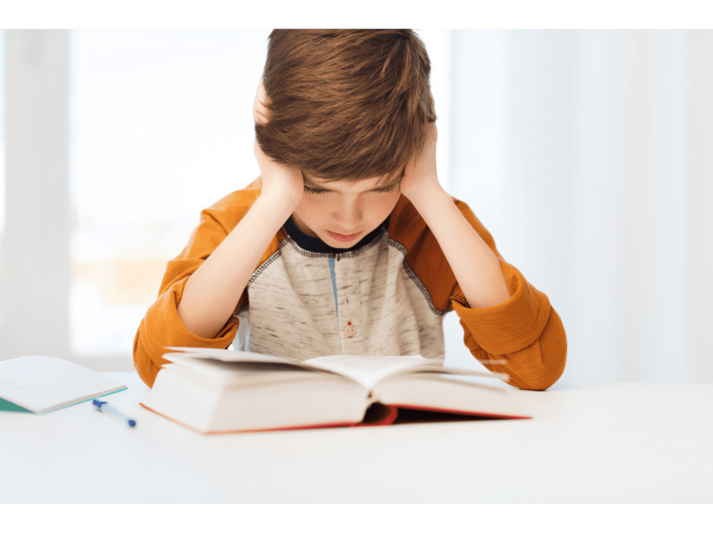 A student with math difficulties with his hands on his head looking worried